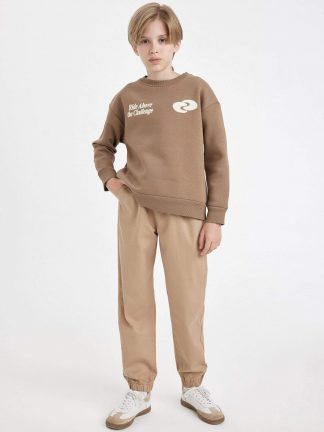 شلوار جاگر پسرانه بژ دفکتو تصویر ۱